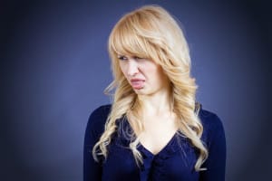 woman with disgusted look on her face